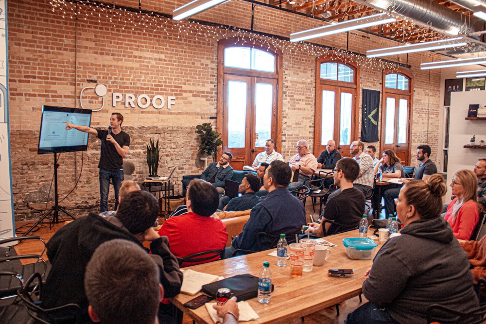 Leadership presenting a company update at a Houston town hall