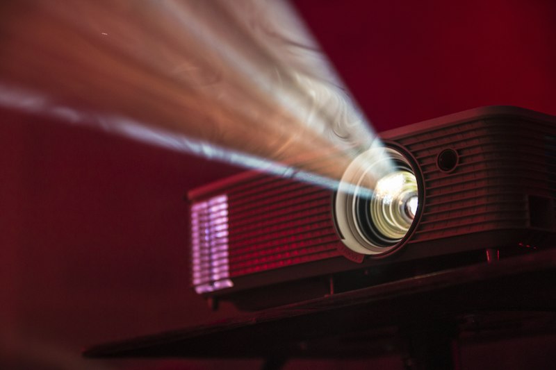 Projector screening an edited corporate video